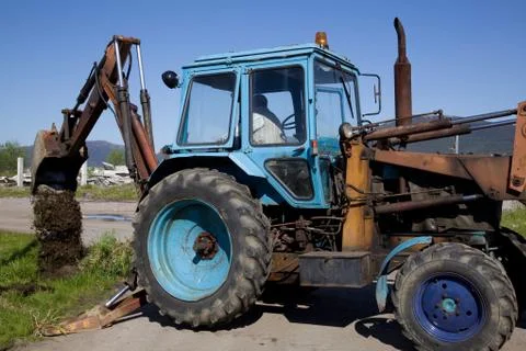 Wheeled tractor to dig Stock Photos