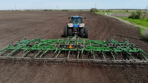 Wheeled tractor with harrows Video stock 155285350