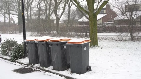 Wheelie bins in the snow Stock Footage 325812494