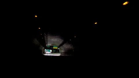 WHEELING WEST VA, DRIVING SHOT, OUT OF TUNNEL, ACROSS BRIDGE TO WHEELING ISLAND Video stock 110928813