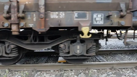 Wheels and bogie of a slow moving freight train seen up close 01 Stock Footage 105848292
