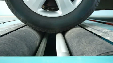 Wheels and tires are checked with the tool. Stock Footage 49090665