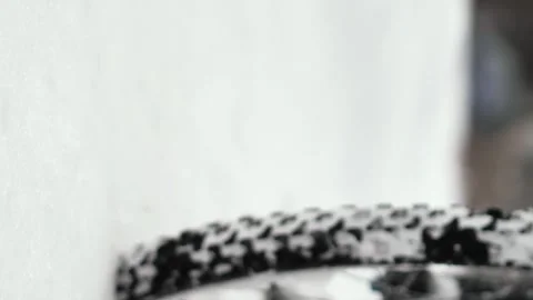 The wheels of a bicycle that rides through deep, freshly fallen snow Stock Footage 263578643