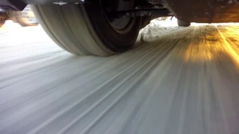 Wheels of a car traveling on winter roads Stock Footage 72286853