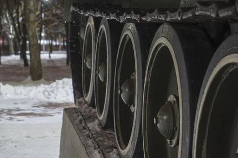Wheels with caterpillars on a blurred background Stock Photos