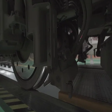 Wheels on chassis of train wagons at workshop in factory Stock Footage 69481579