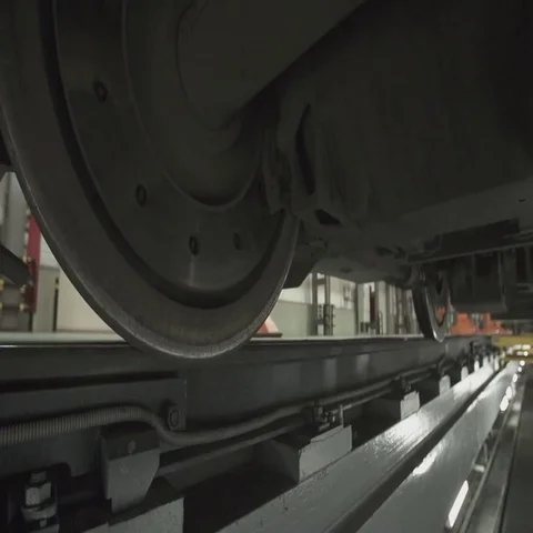 Wheels on chassis of train wagons at workshop in factory Stock Footage 69481993