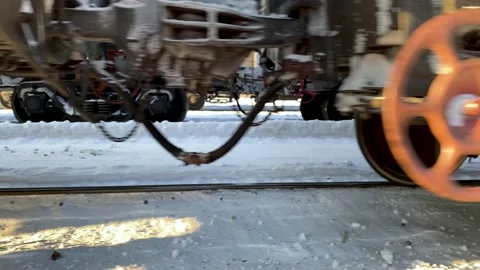 Wheels of a freight train leaving the station slowly.  Stock Footage 148231538