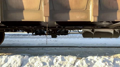 Wheels of a freight train leaving the station slowly.  Stock Footage 148231639