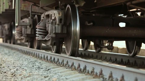 The wheels of old train on the railway track passing by camera. Close up shot Stock Footage 106298787
