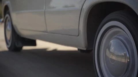 Wheels of old white soviet vintage car driving on dirt road Stock Footage 127849853