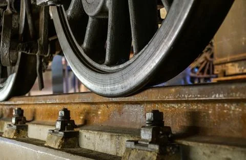 Wheels of a railway train on rails close up, cargo transportation Stock Photos