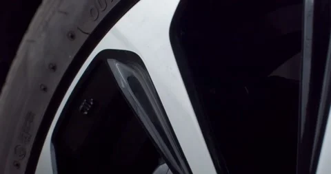 The wheels reflect light in silver and black.Polished wheels. Stock Footage 267276094