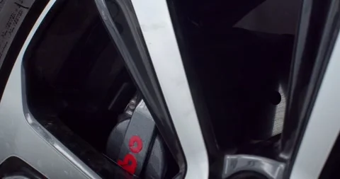 The wheels reflect light in silver and black.Polished wheels. Stock Footage 277843807