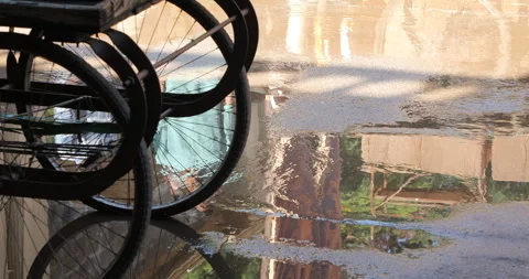 Wheels reflection on road in rain water Stock Footage 324499176