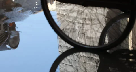 Wheels reflection on road in rain water Stock Footage 324499277