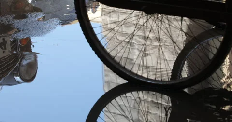 Wheels reflection on road in rain water 스톡 동영상 324499417