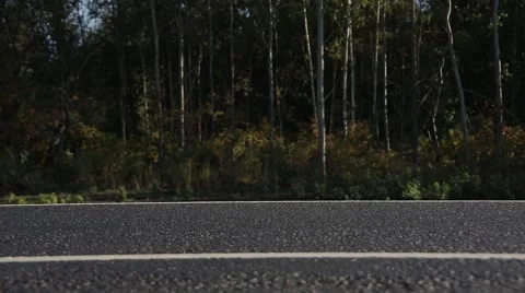 The wheels ride on the paved road Vídeos de archivo 42889154