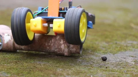 Wheels of a robot car spinning that is controlled wirelessly Video stock 298474147