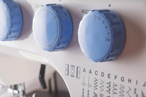 Wheels for selecting the sewing machine program mode. Closeup view. 스톡 사진