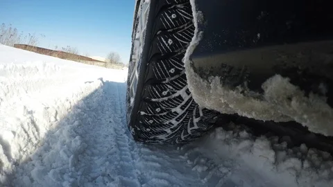 Wheels in the snow close-up. Difficult conditions for car movement Video stock 87782573