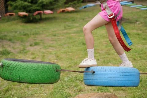 Wheels suspended at height for passing the obstacles of rope course Stock Photos