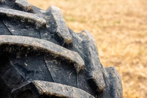 Wheels of tractor plowing field Stock Photos