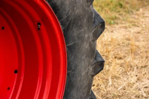 Wheels of tractor plowing field Stock Photos