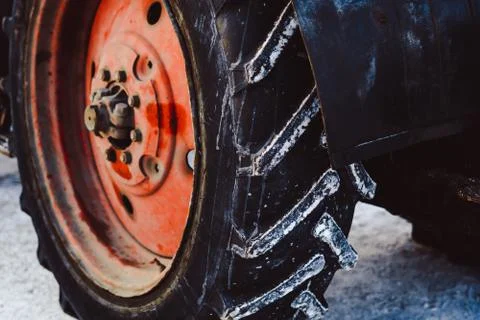 The wheels of the tractor in the snow Stock Photos