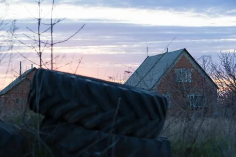 Wheels from a tractor on a sunset background Foto stock
