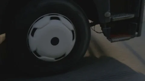 Wheels truck with freight container rotating during move on highway road Stock Footage 82793244