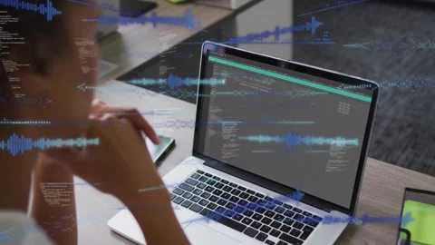 When code loading female developer resting chin watching blue waveforms emerging Stock Footage 317593214