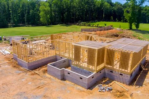 When constructing a home, what are wooden beams framing roof wall 스톡 사진