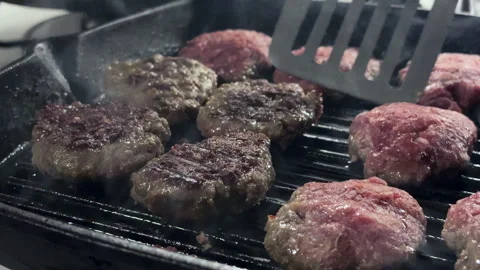 When cooking meatballs on a cast-iron grill 스톡 동영상 345750910