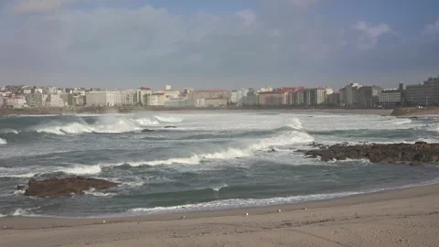 When Giants Collide: The Dance of Waves and Cityscape Stock Footage 266917470