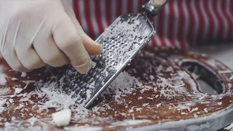 When grating coconut Stock Footage 139715595