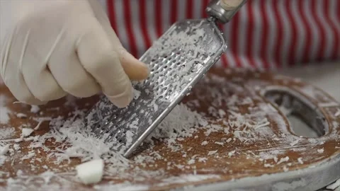 When grating coconut Stock Footage 139715666