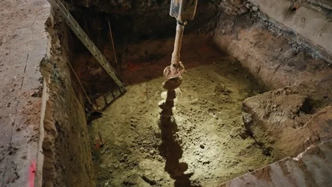 When laying the foundation of the building, equipment for drilling the Stock Footage 263844015