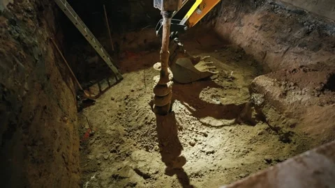When laying the foundation of the building, equipment for drilling the Stock Footage 263844324
