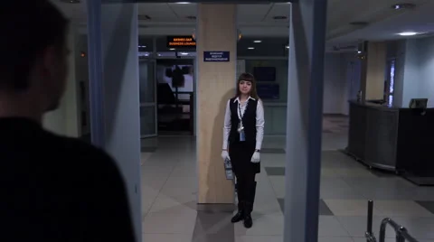When passing through metal detector lights up red, inspection of men Video stock 64989816