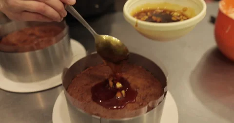When preparing a chocolate cake by a professional confectioner Stock Footage 251722649