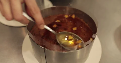 When preparing a chocolate cake by a professional confectioner Stock Footage 251722955