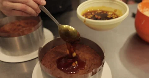 When preparing a chocolate cake by a professional confectioner Stock Footage 251723014