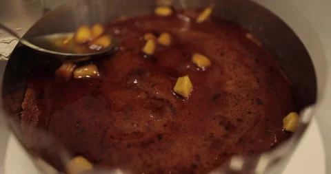 When preparing a chocolate cake by a professional confectioner Stock Footage 251723154