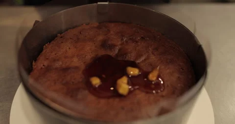 When preparing a chocolate cake by a professional confectioner Stock Footage 251723279