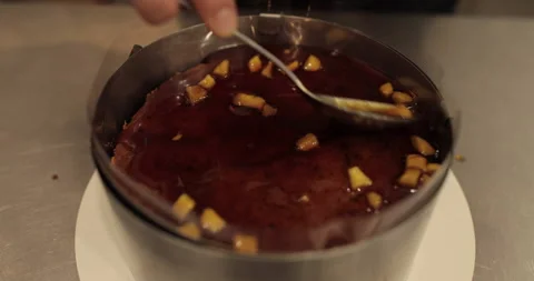 When preparing a chocolate cake by a professional confectioner Stock Footage 251723469
