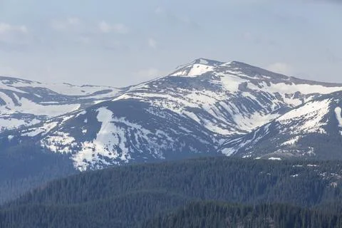 When preparing to climb a mountain, pack a light heart. Stock Photos