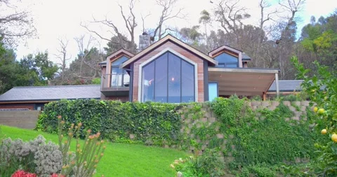 When recording begins, steady camera is panning left across hillside garden to Stock Footage 341467452
