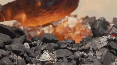 When removing the red-hot metal form of hot coal. Slow motion. Stock Footage 54095503