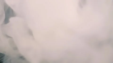 When the smoke clears, a Ripple coin appears on the surface Stock Footage 313145256